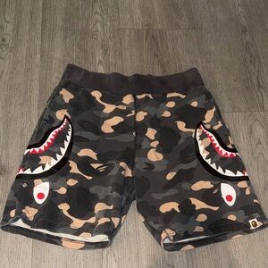 A bathing Ape Authentic Camo Shark Face Graphic Shorts in Black/Tan